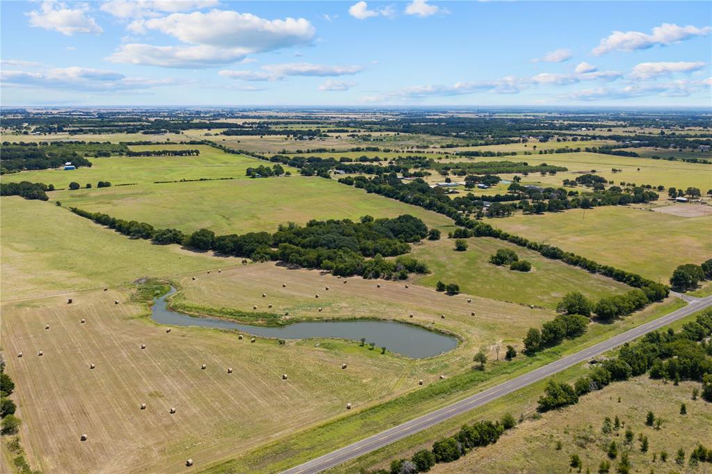 Expansive open land featuring diverse terrain and natural water features Expansive open land featuring diverse terrain and natural water features