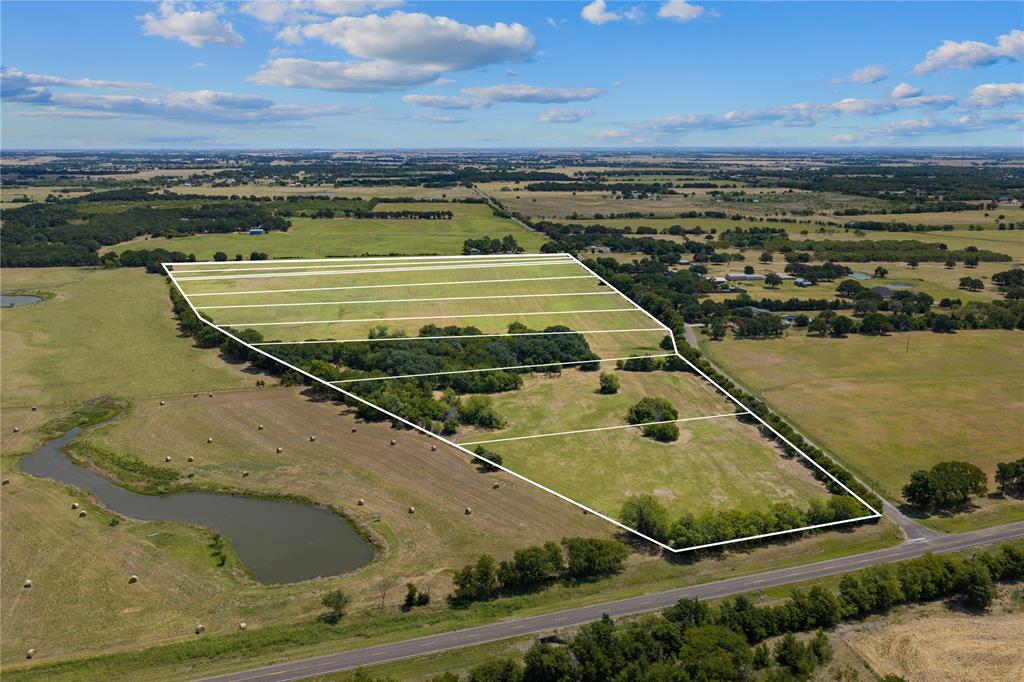 Expansive property featuring a pond, mature trees, open fields, and road frontage Expansive property featuring a pond, mature trees, open fields, and road frontage