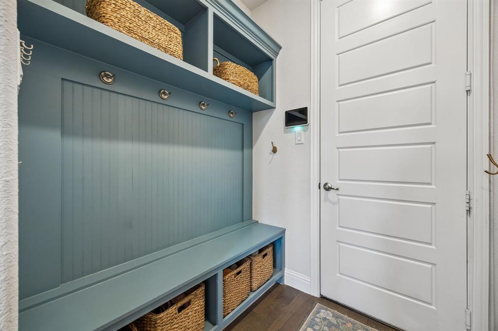 Mudroom featuring dark wood-style flooring