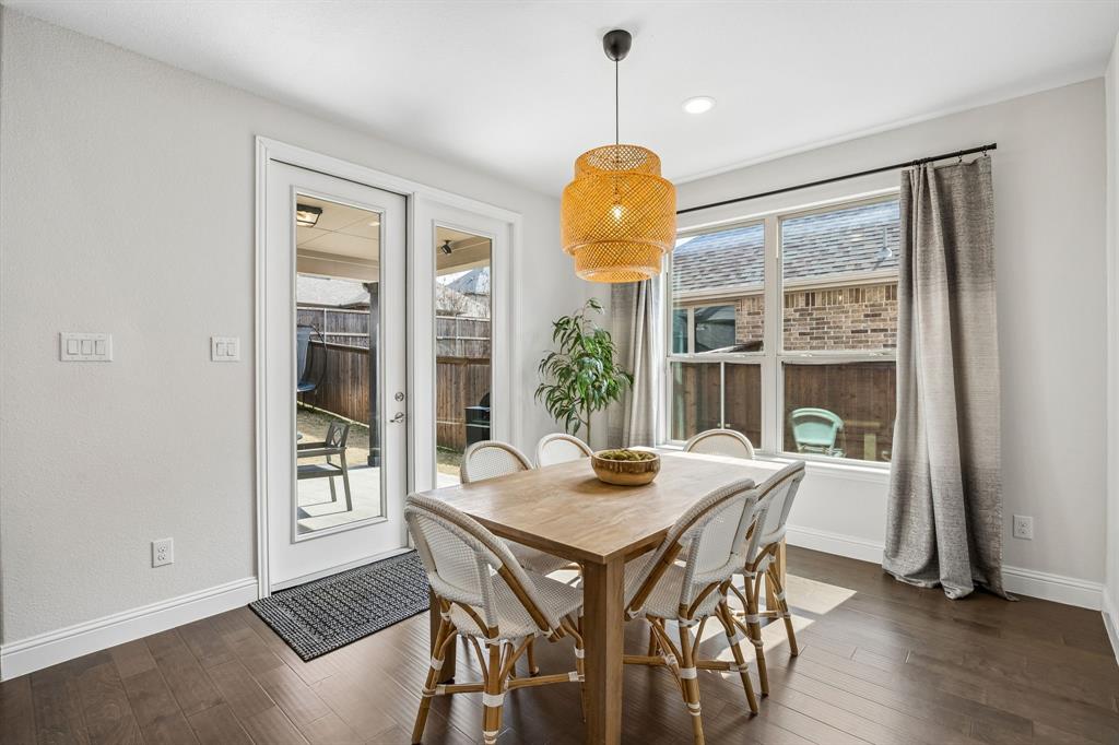 Dining area featuring dark wood finished floors