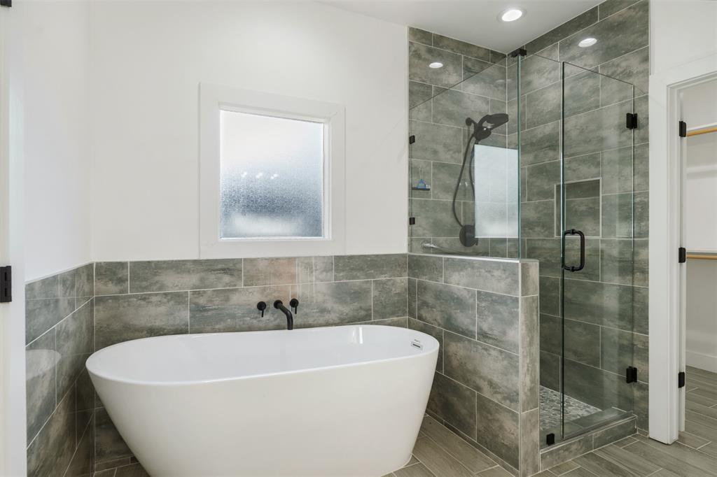 primary bath with separate soaking tub and shower