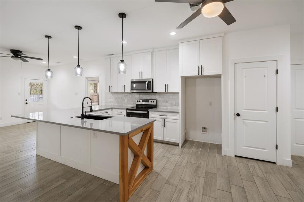 Kitchen with farmhouse sink and room for barstools Kitchen with farmhouse sink and room for barstools