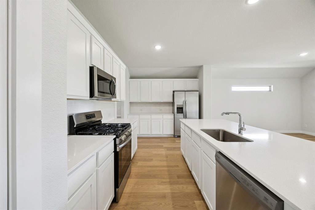 Kitchen in the Heisman home plan by Trophy Signature Homes – REPRESENTATIVE PHOTO Kitchen in the Heisman home plan by Trophy Signature Homes – REPRESENTATIVE PHOTO