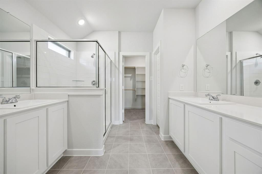 Primary Bathroom in the Heisman home plan by Trophy Signature Homes – REPRESENTATIVE PHOTO