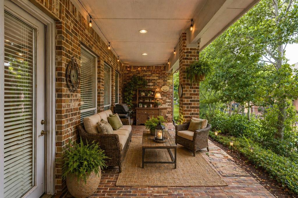 Brick-paved covered patio with recessed lighting - Virtually Staged