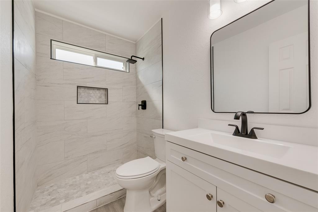 Bathroom with vanity and a stall shower