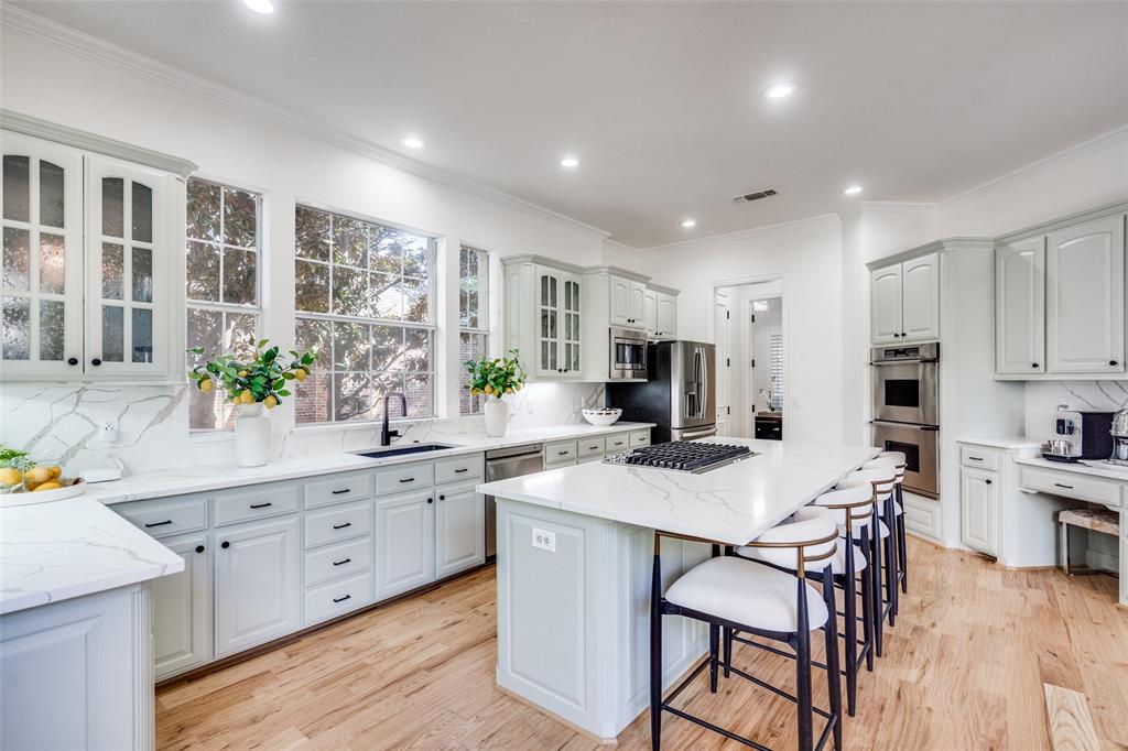 Double ovens, coffee bar and quartz countertops make this kitchen complete.