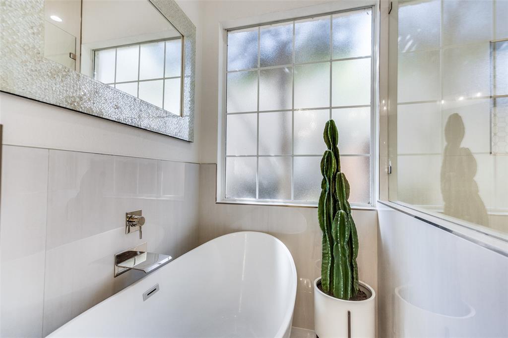 Relax and soak in this freestanding tub with waterfall faucet.