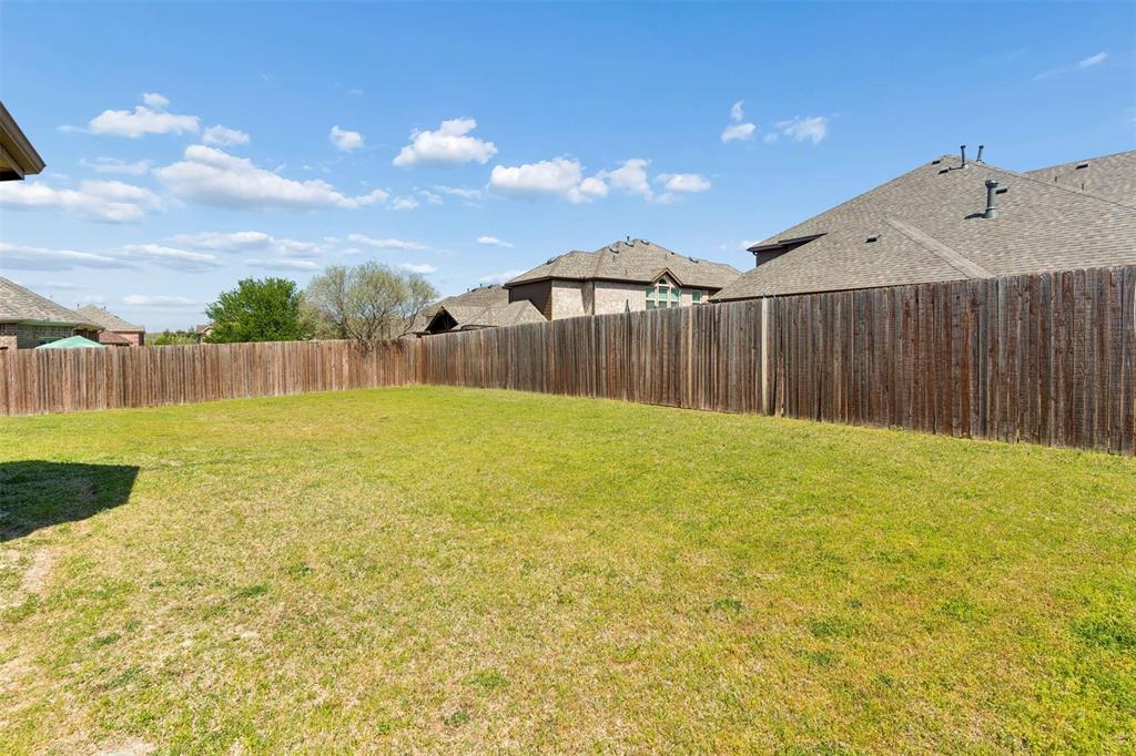 View of fenced backyard