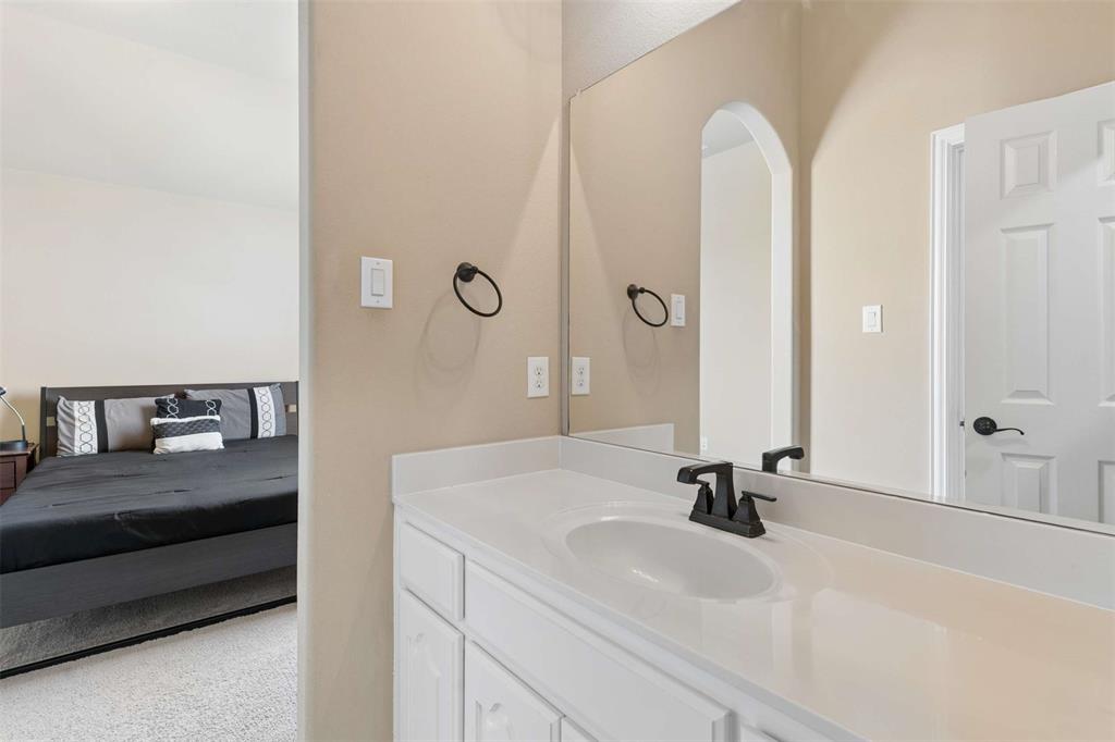 Ensuite bathroom featuring vanity