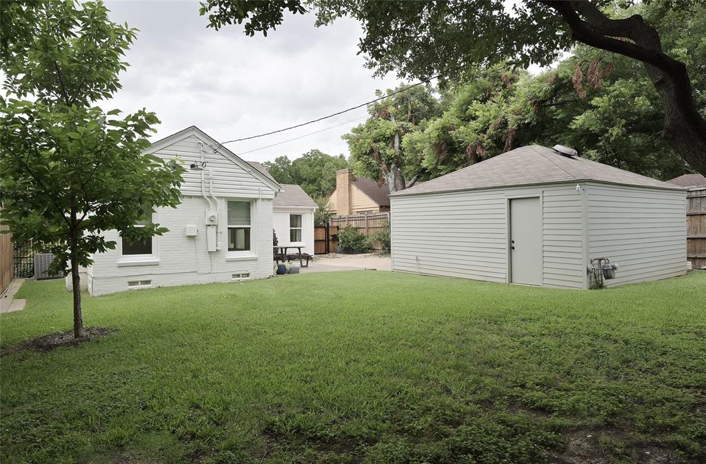 Backyard facing house & garage