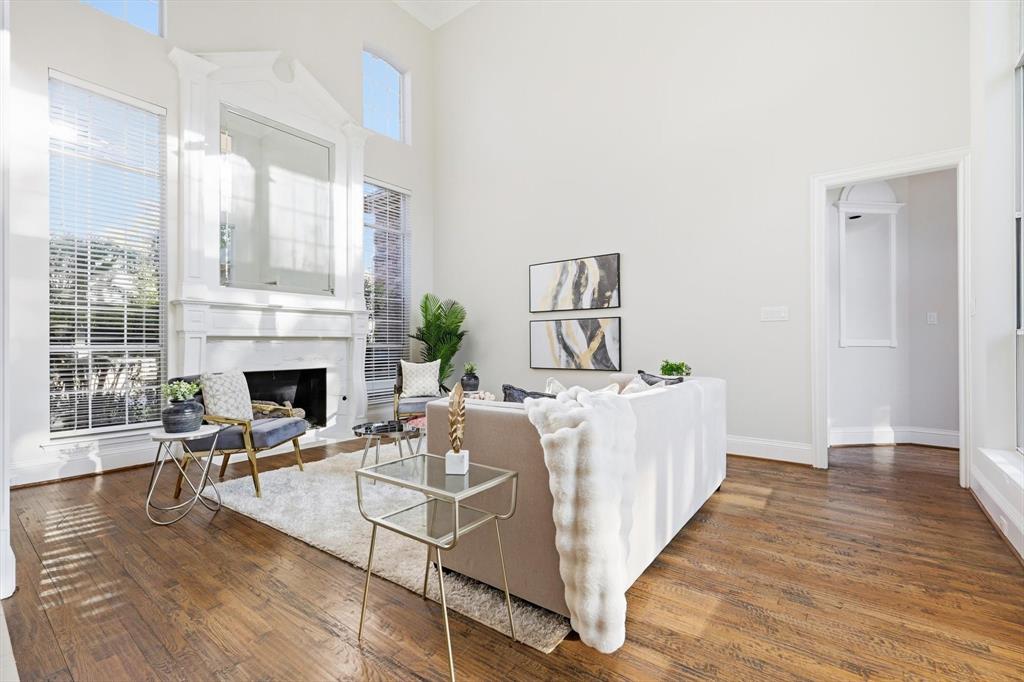 Light-filled front living room with view of back yard.