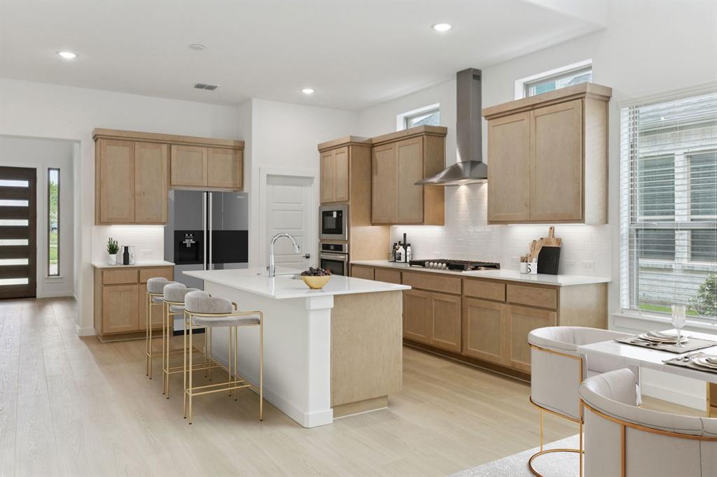 Kitchen in the Monet II home plan by Trophy Signature Homes – REPRESENTATIVE PHOTO