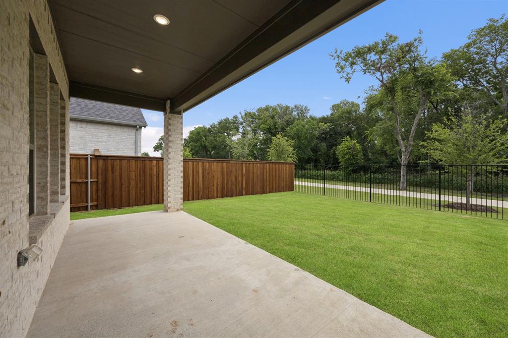 Covered Patio in the Monet II home plan by Trophy Signature Homes – REPRESENTATIVE PHOTO