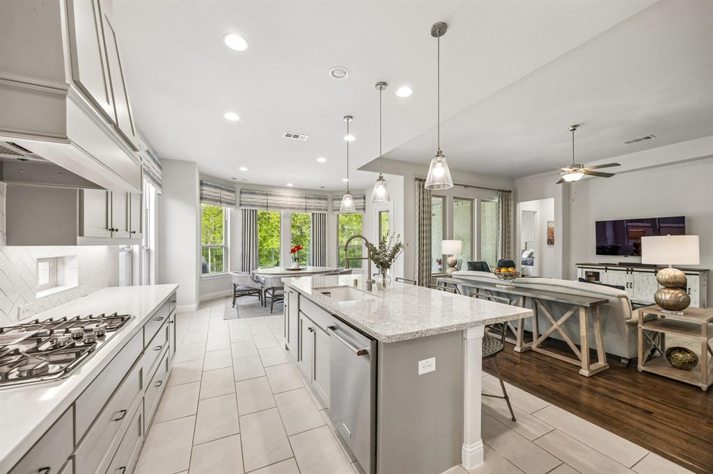 Bright, expansive open-concept kitchen and living area designed for seamless entertaining and modern daily living.