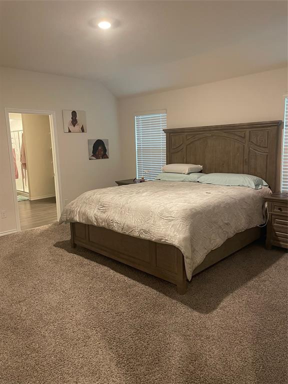 Bedroom featuring carpet floors, lofted ceiling, and recessed lighting