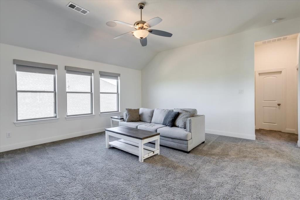 Gameroom upstairs offers a perfect secondary living space.