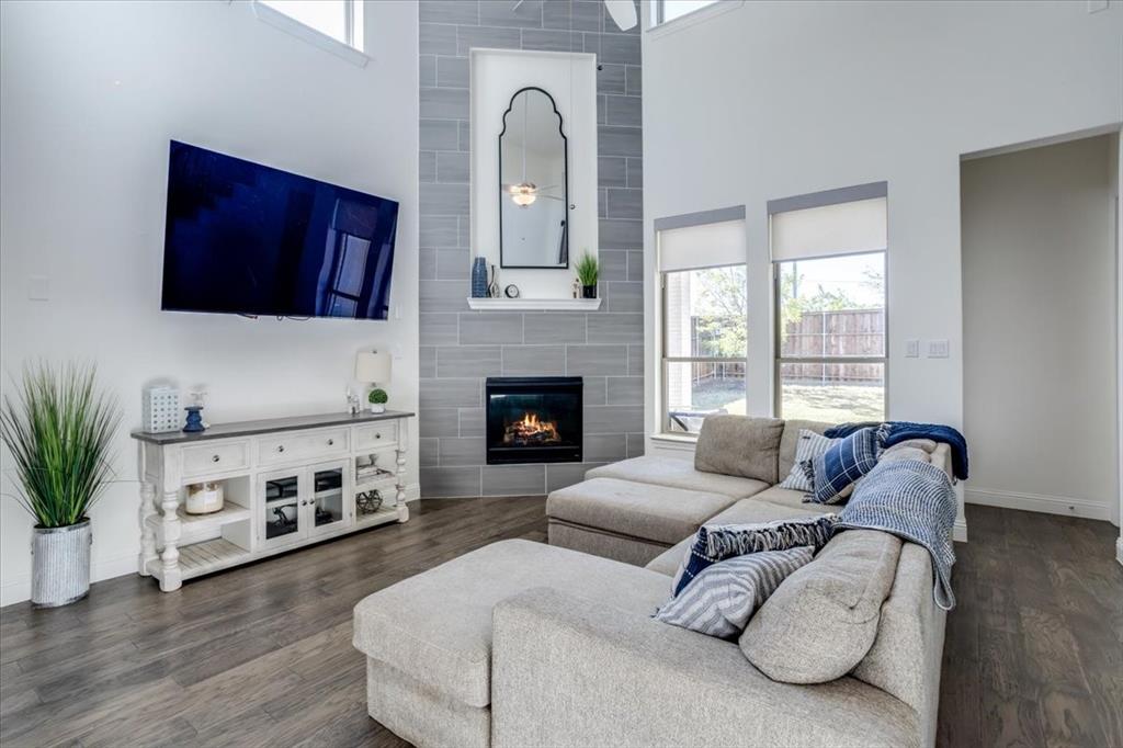 5" plank engineered hardwood from entry through the family room including kitchen, dining, and hallways.