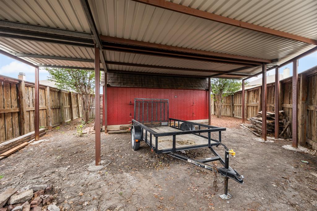 Large (approx 40X21)  gated carport with 9.5ft clearance.