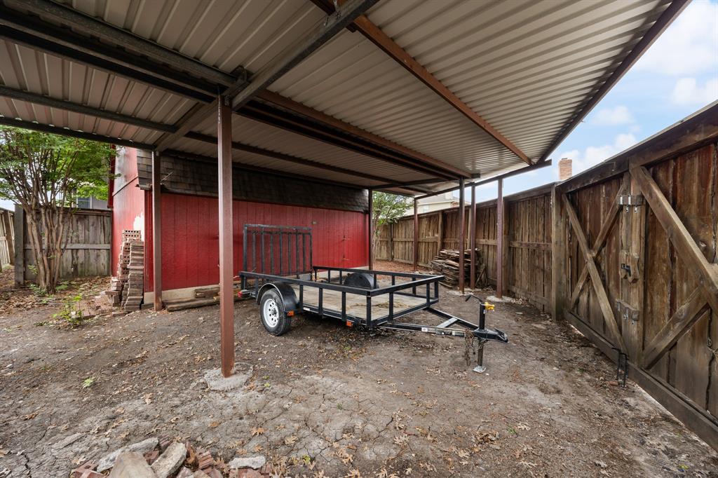 Gated carport allows for additional parking for a boar, RV, worktruck, etc.