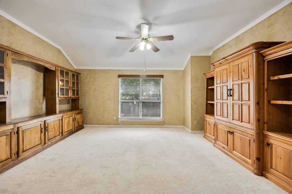2nd floor living area with TV cabinet and storage or display cabinets.