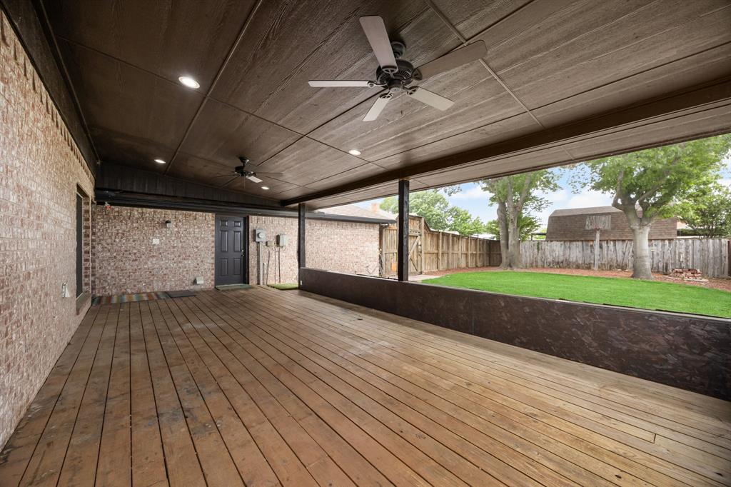 Spacious deck overlooking the large backyard