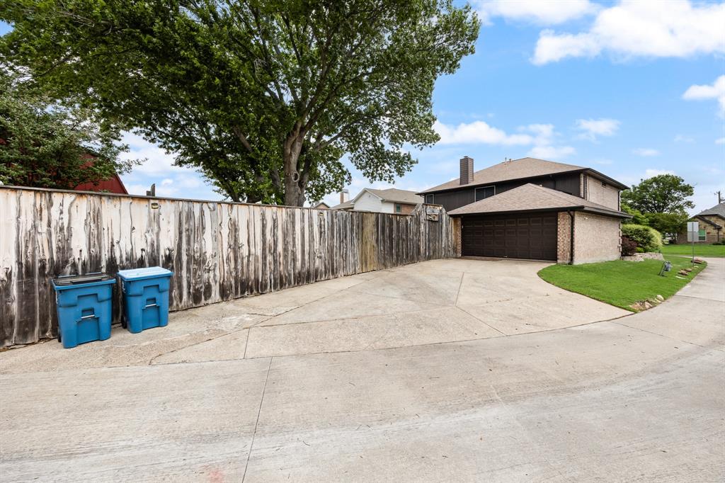 Extra long driveway and easy to access secure parking behind the gated fence.  Fence has