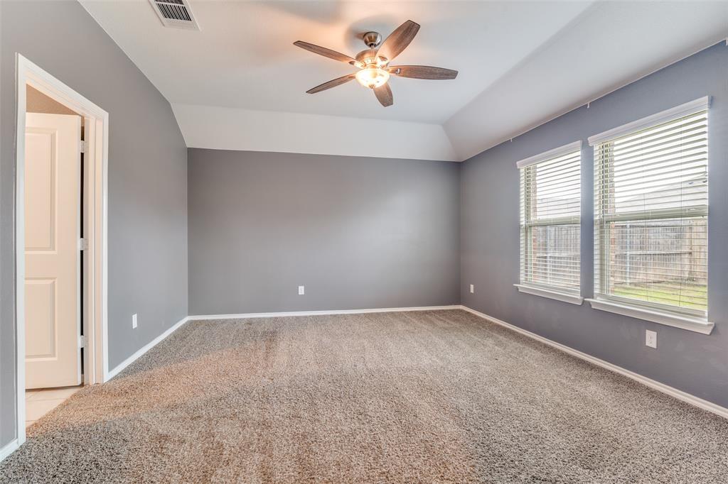 Primary bedroom with ensuite bathroom and two walk in closets