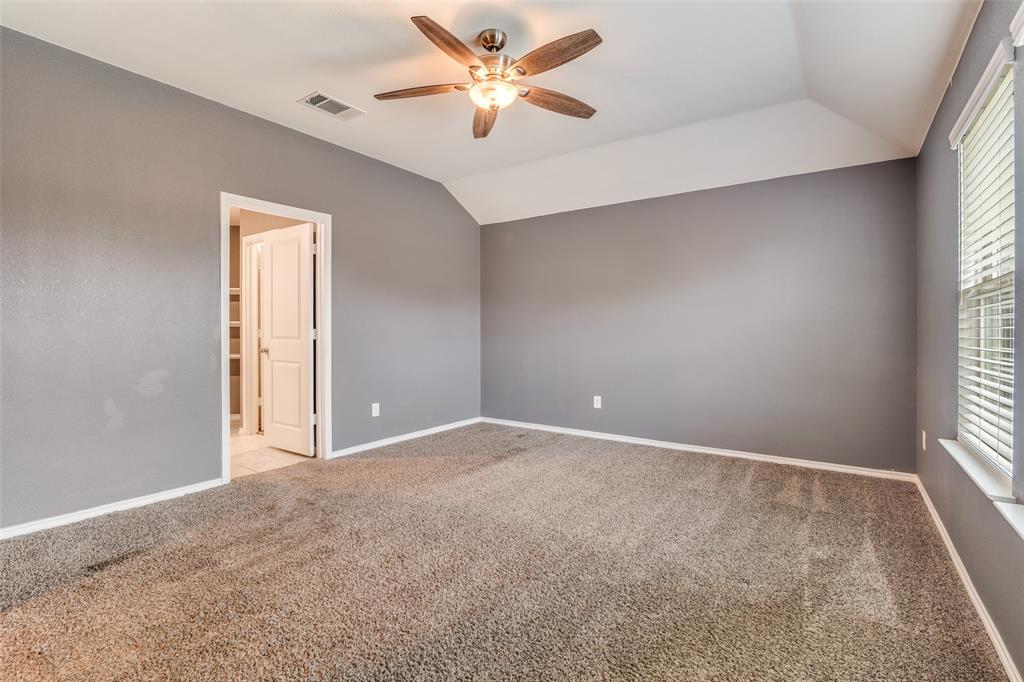 Primary bedroom with ensuite bathroom and two walk in closets
