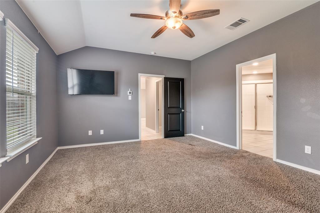 Primary bedroom with ensuite bathroom and two walk in closets