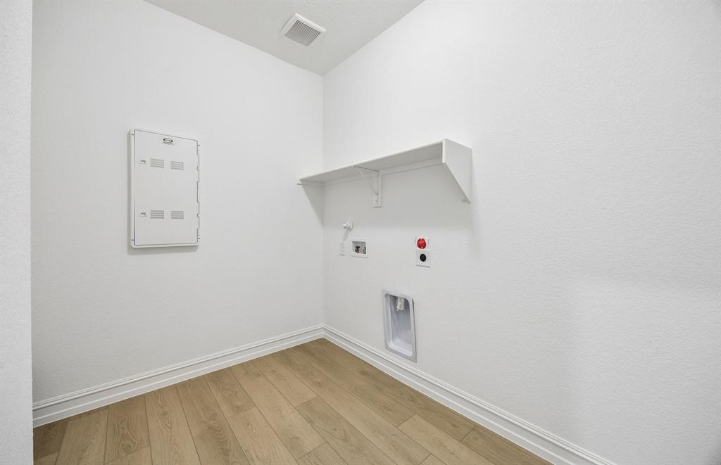 Laundry room with built-in shelving