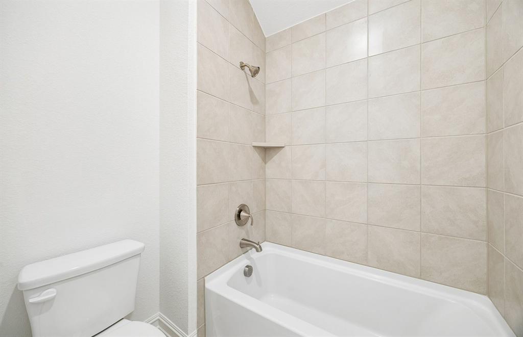 Secondary bath with tile surrounded shower