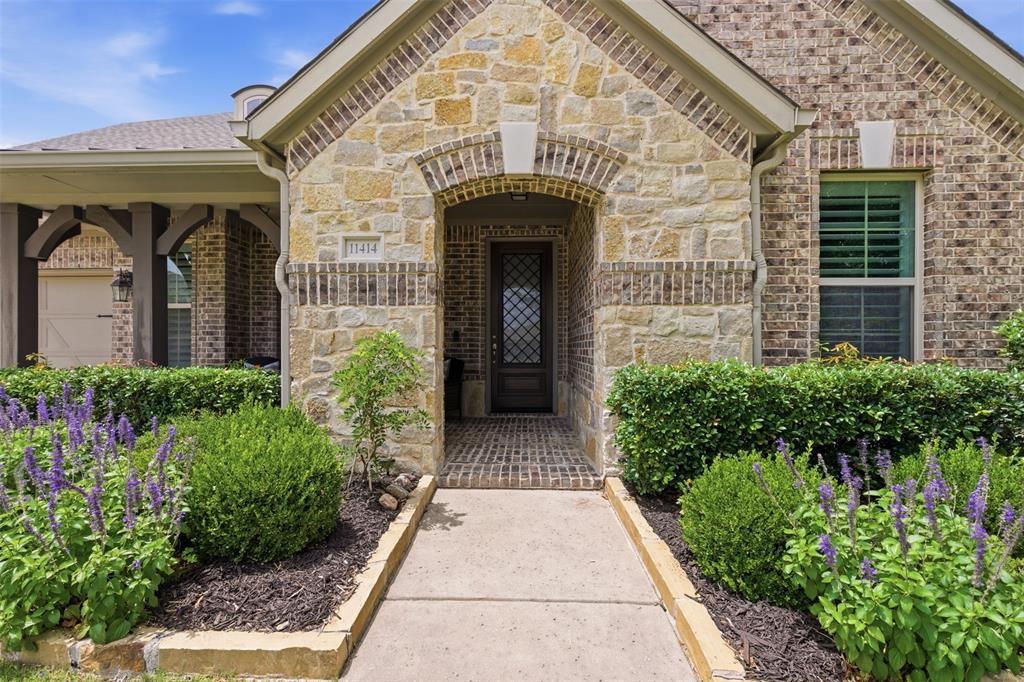 Stone and brick exterior with arched entryway