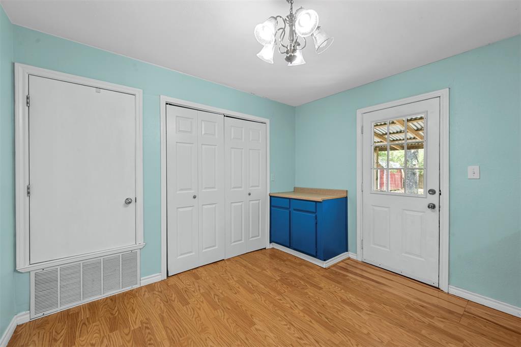 Entryway with a notable chandelier and light hardwood / wood-style flooring