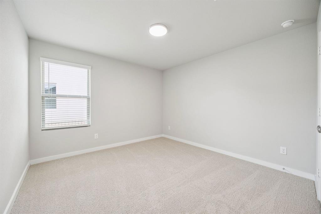 Bedroom in the Hayden home plan by Trophy Signature Homes – REPRESENTATIVE PHOTO