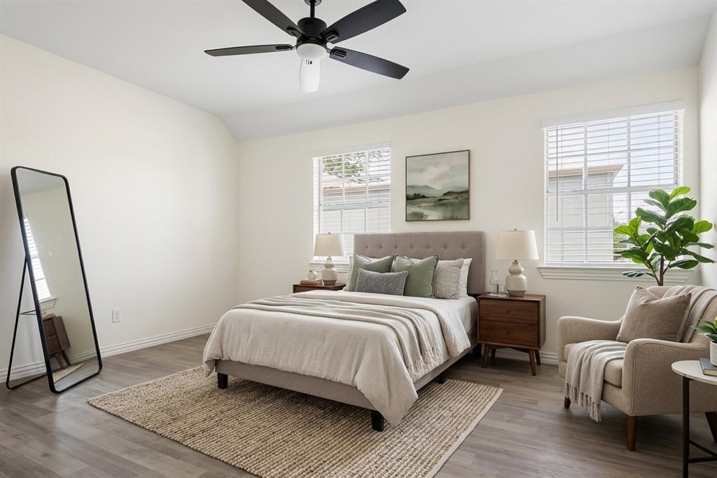 Wood-finish flooring, recessed lighting, and a ceiling fan with integrated light