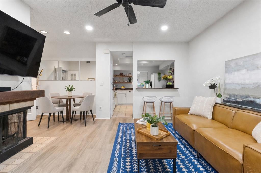 cozy wood burning fireplace centrally located between living and dining spaces cozy wood burning fireplace centrally located between living and dining spaces