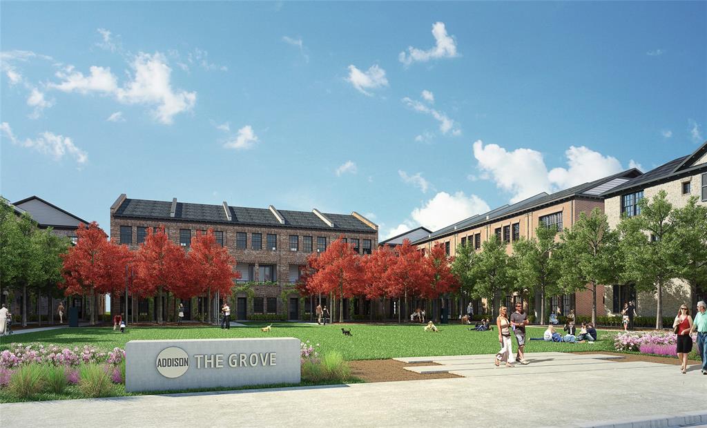 Central green space featuring a manicured lawn, established trees, and seasonal red foliage