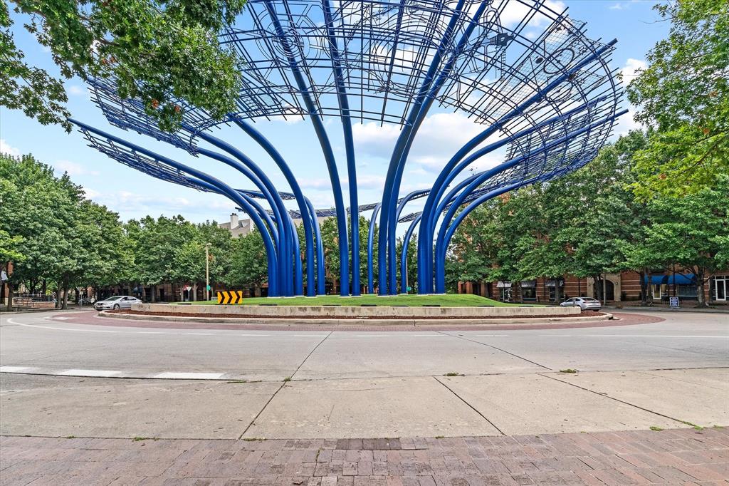 Central roundabout featuring a prominent blue sculptural installation