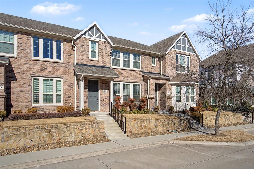 Brick exterior townhome with contrasting gables and white trim Brick exterior townhome with contrasting gables and white trim