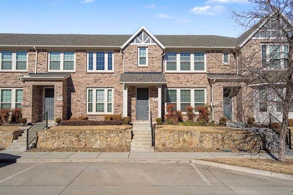 Brick exterior with architectural gables, multiple windows, and a covered entry Brick exterior with architectural gables, multiple windows, and a covered entry
