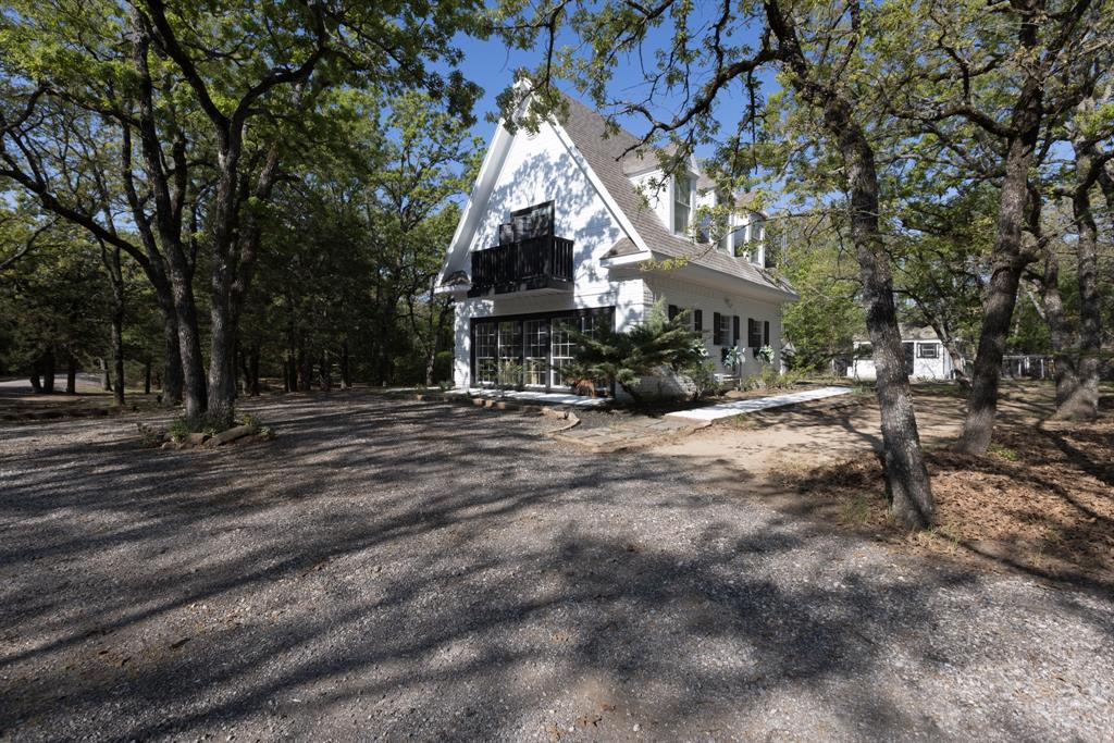 A framed guest house near the front of the property.