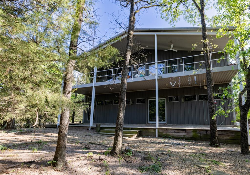 7500 sq ft Barndominium with 5000 sq ft of living space and a 2500 sq ft workshop featuring a 4-car garage, office and full bath.