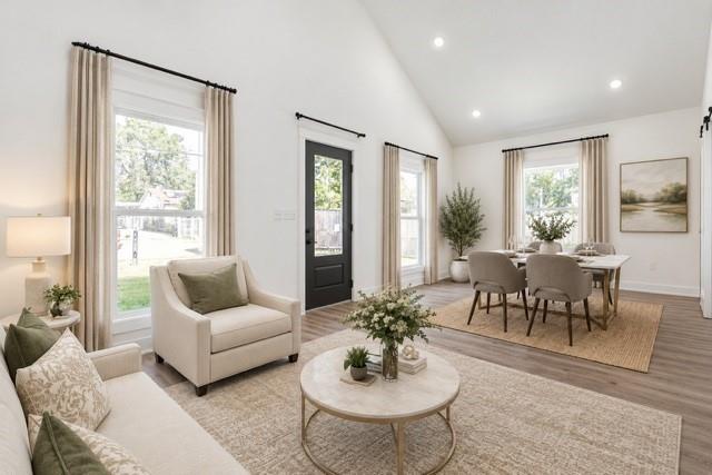 Virtual staging -Vaulted ceilings, recessed lighting, wood-finish flooring, multiple windows, and a glass-paneled exterior door Virtual staging -Vaulted ceilings, recessed lighting, wood-finish flooring, multiple windows, and a glass-paneled exterior door