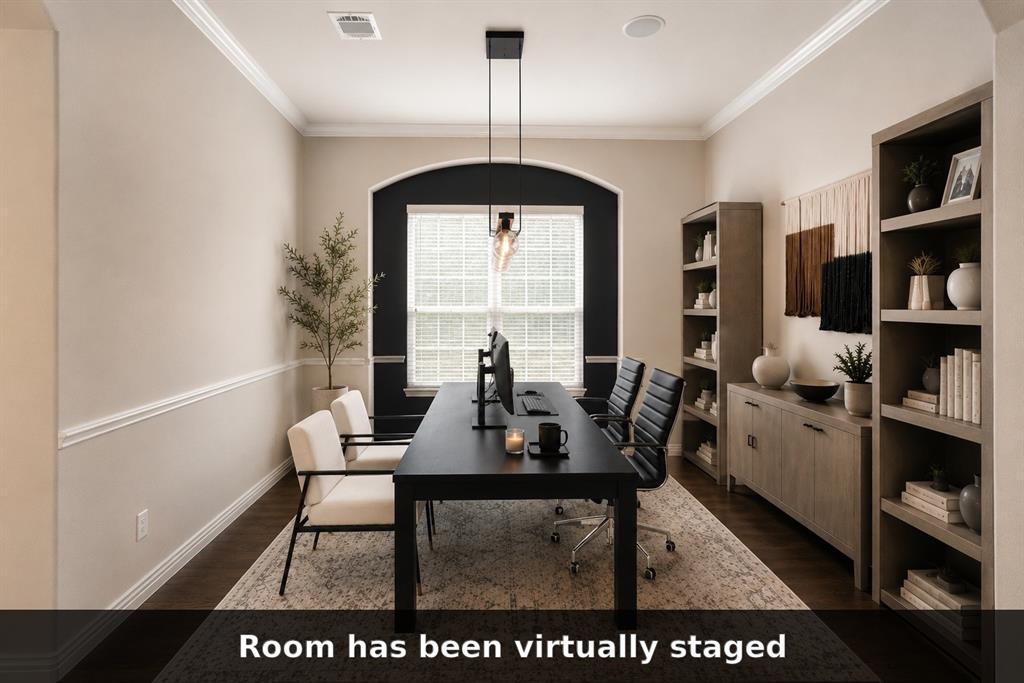 Dining room virtually staged as an office to demonstrate its flexible use.