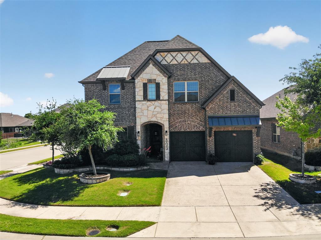 Distinctive exterior, mature landscaping and a corner-lot setting create strong curb appeal.