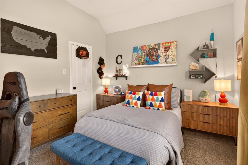 Bright secondary bedroom provides comfortable space for family members or guests.