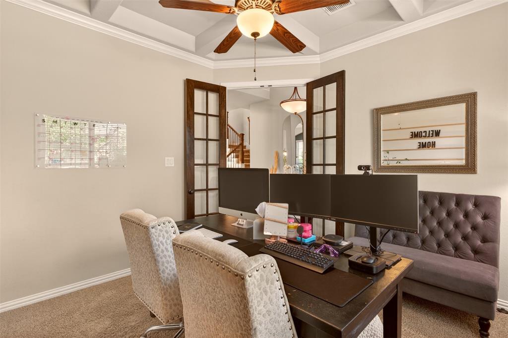 Study with French doors provides privacy for working, reading or meeting with clients.