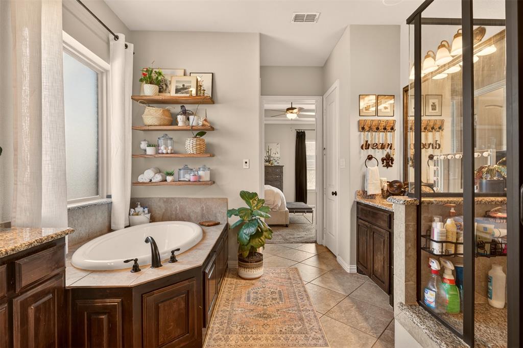 Primary bath includes a soaking tub, separate shower and abundant natural light.