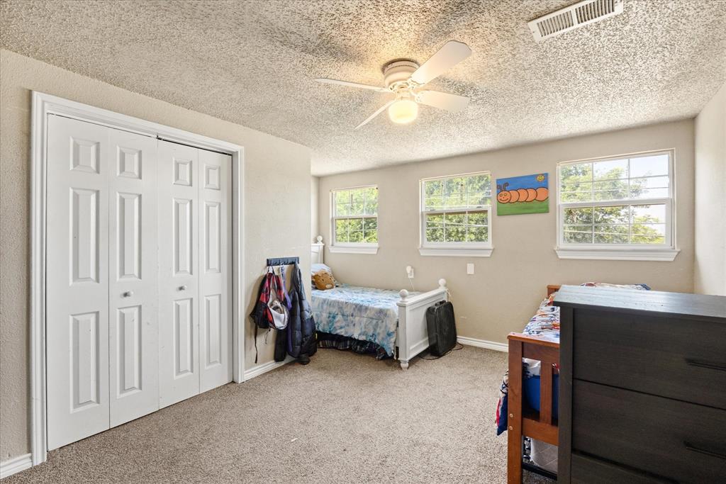 One of two secondary bedrooms upstairs.